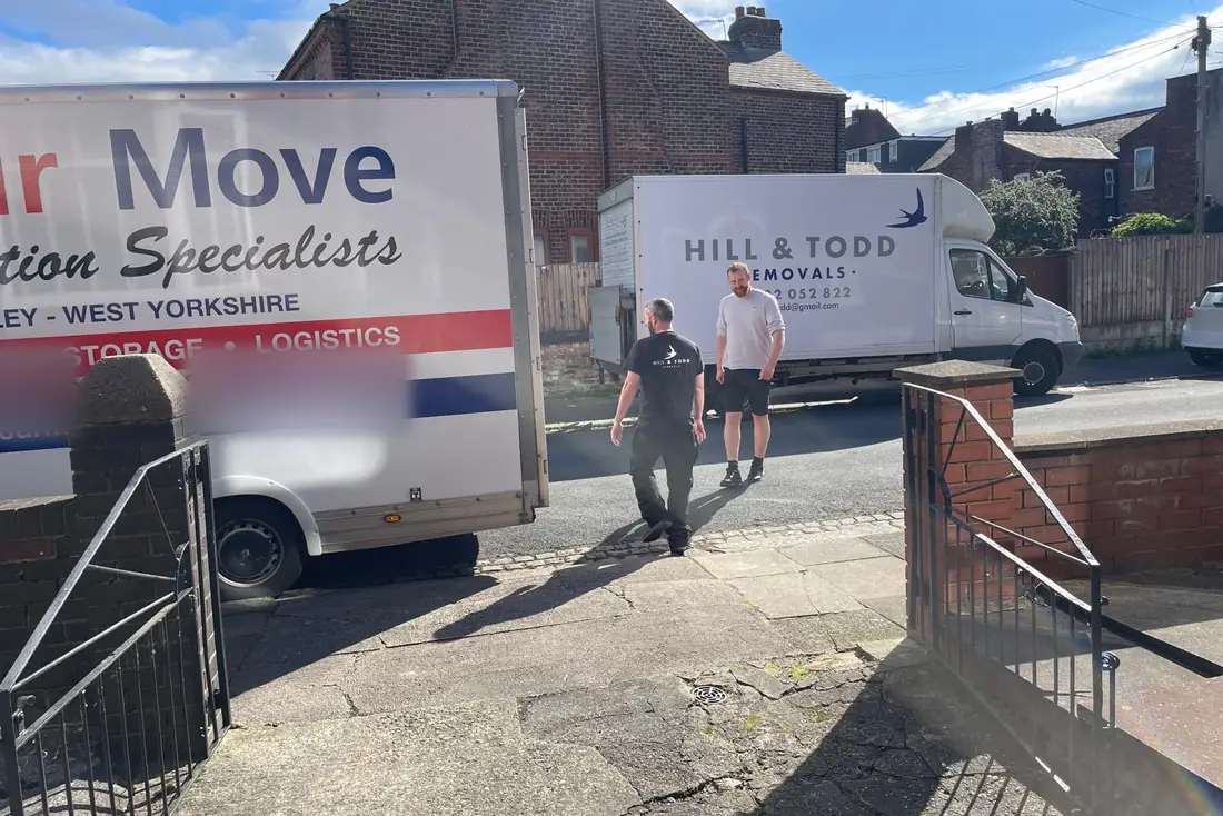 The Hill & Todd Luton out on a job, two of the team in their branded tops